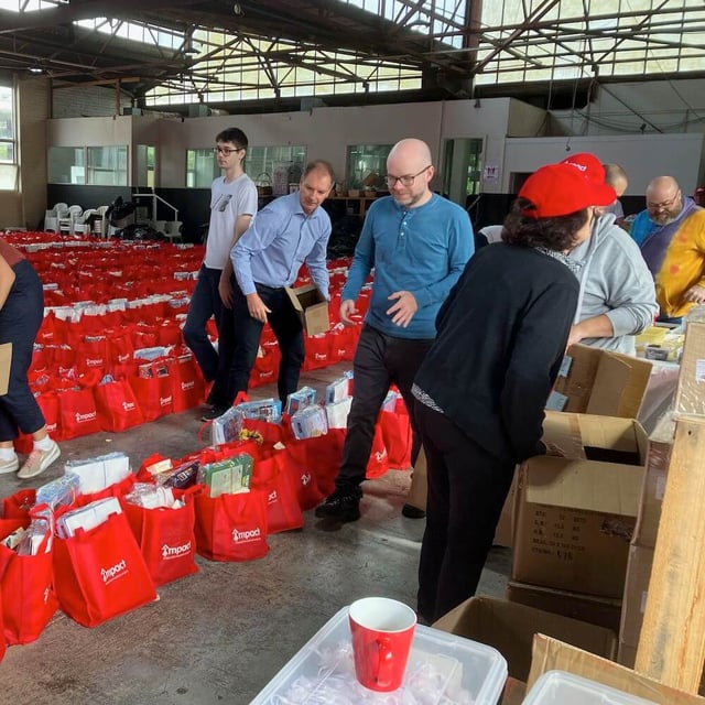PhoenixDX Staff Volunteering to Wrap and Deliver “Bags of Love” for Women Escaping Family Violence